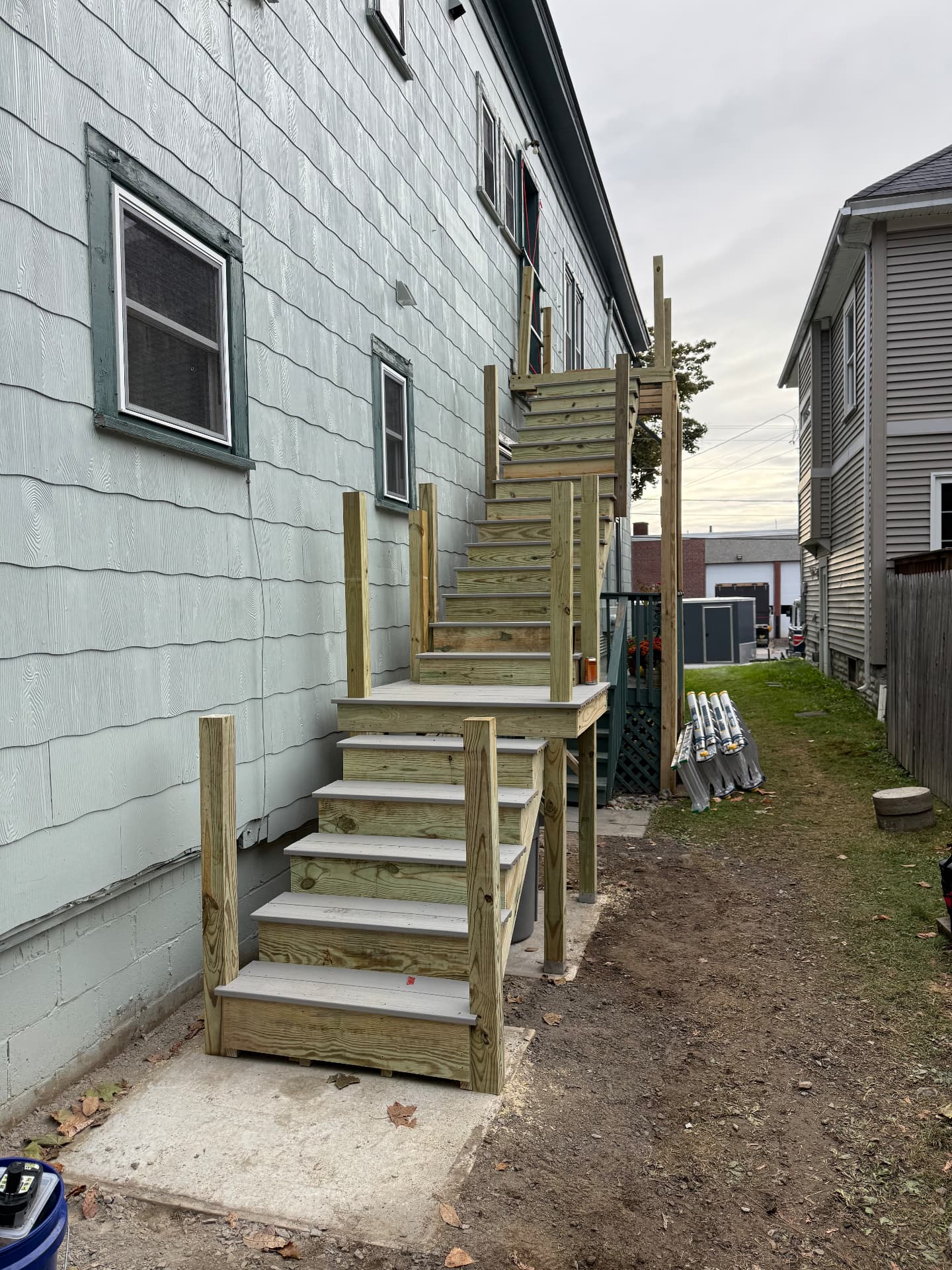 Multi landing exterior stairway built along the side of a home
