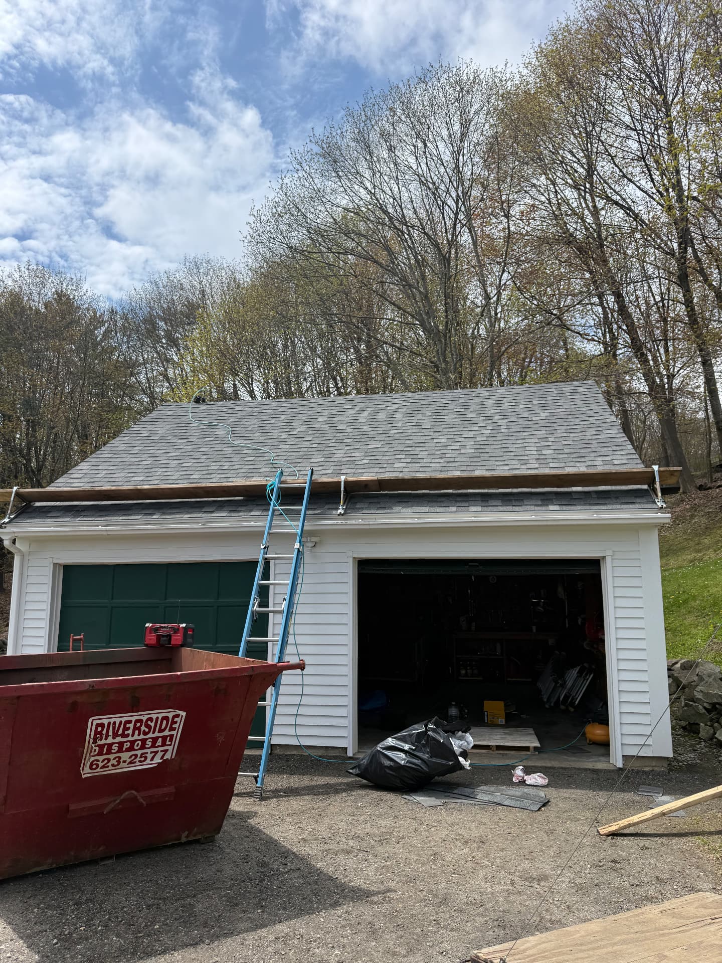 Completed architectural shingle roof on a two bay detached garage