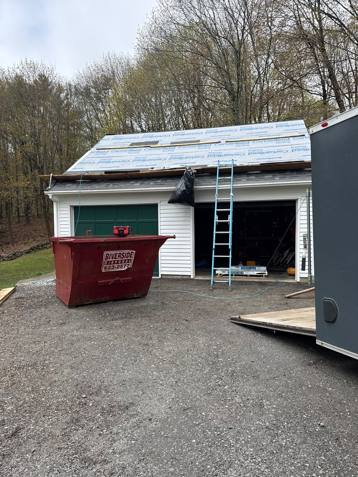 Synthetic roofing underlayment installed on a garage before shingles