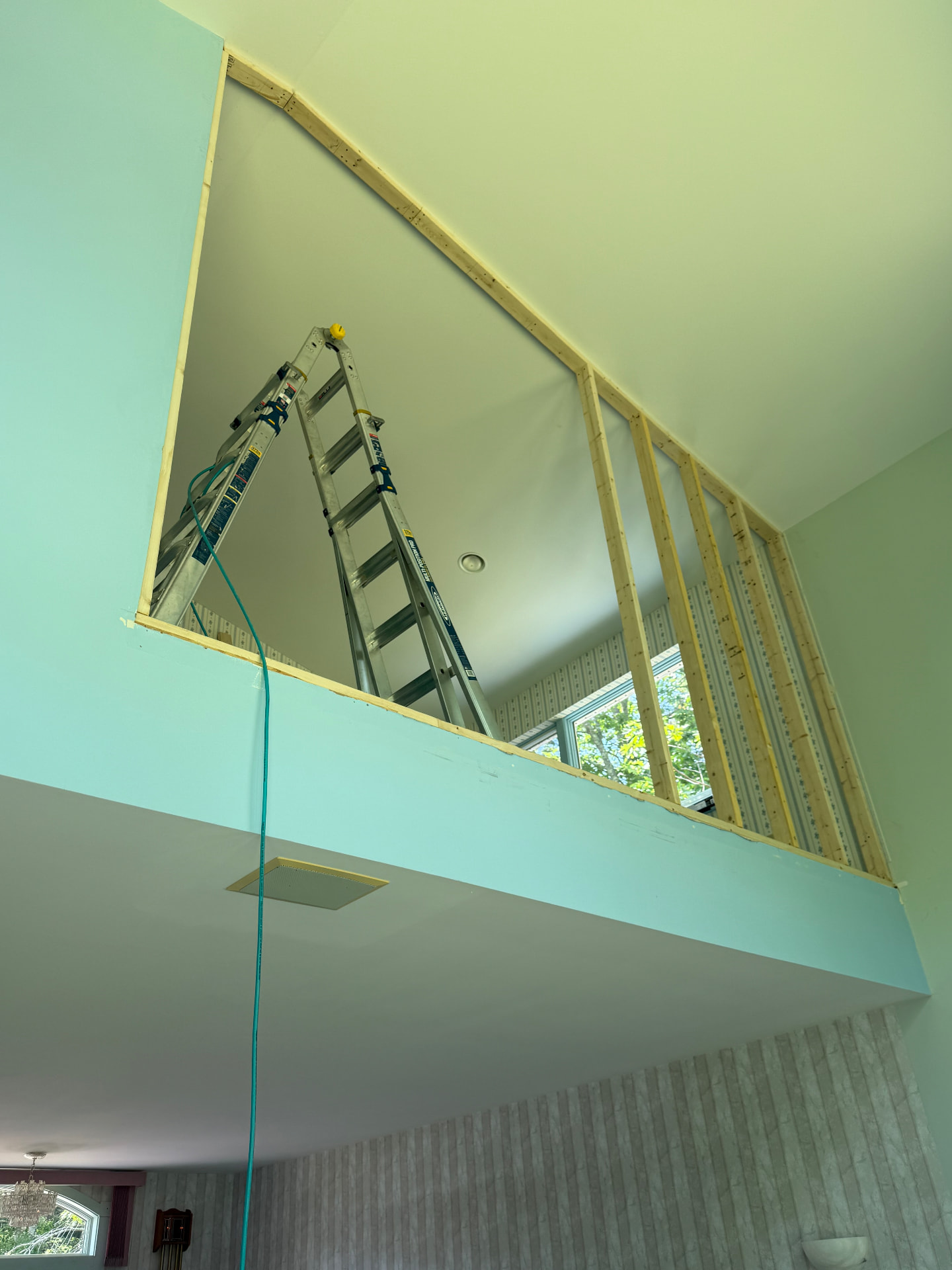 New stud wall framing for a loft enclosure during an interior remodel