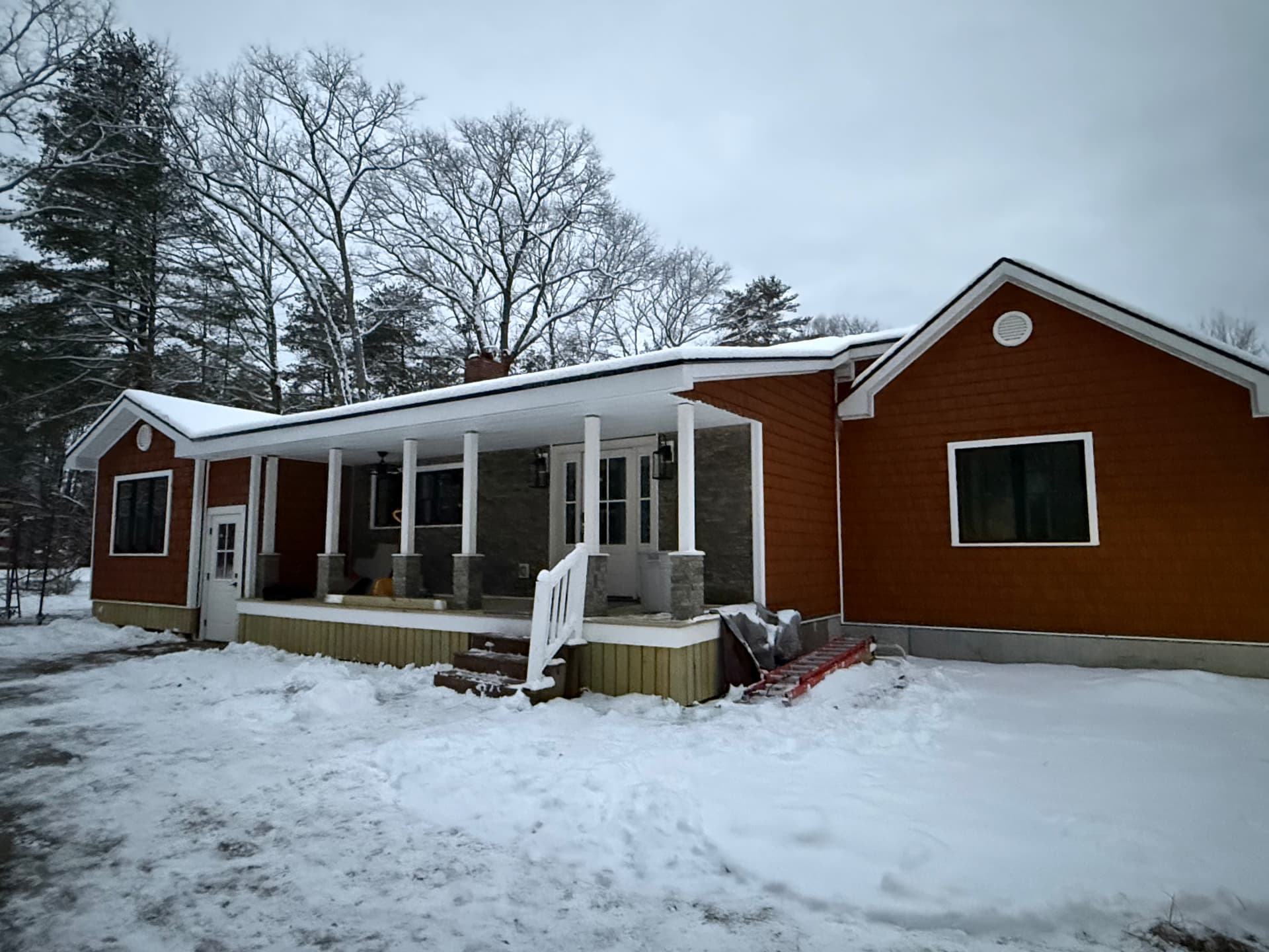 Ranch home with a covered farmer's porch in central Maine