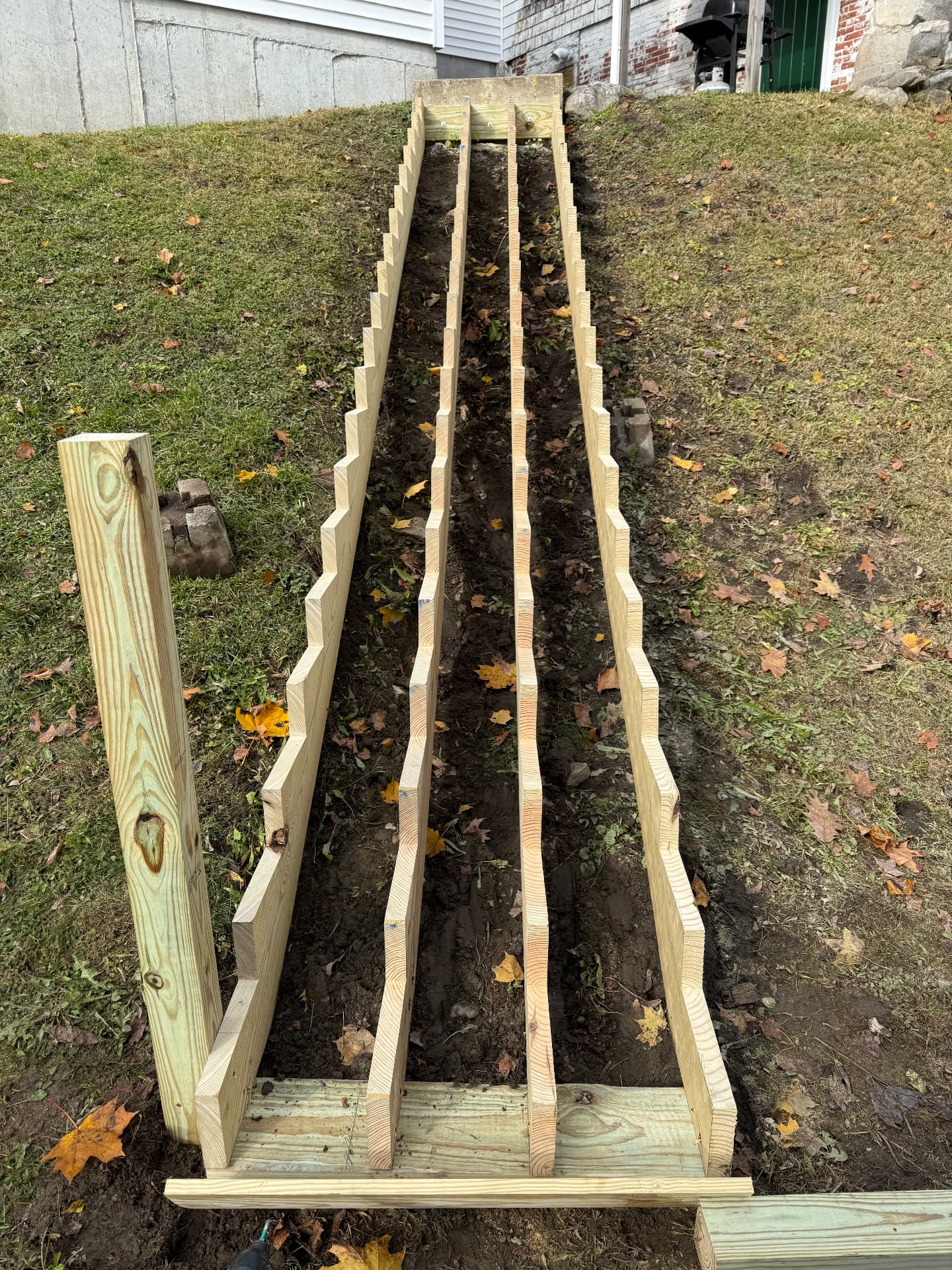 Stair stringers and base framing laid out on site before decking