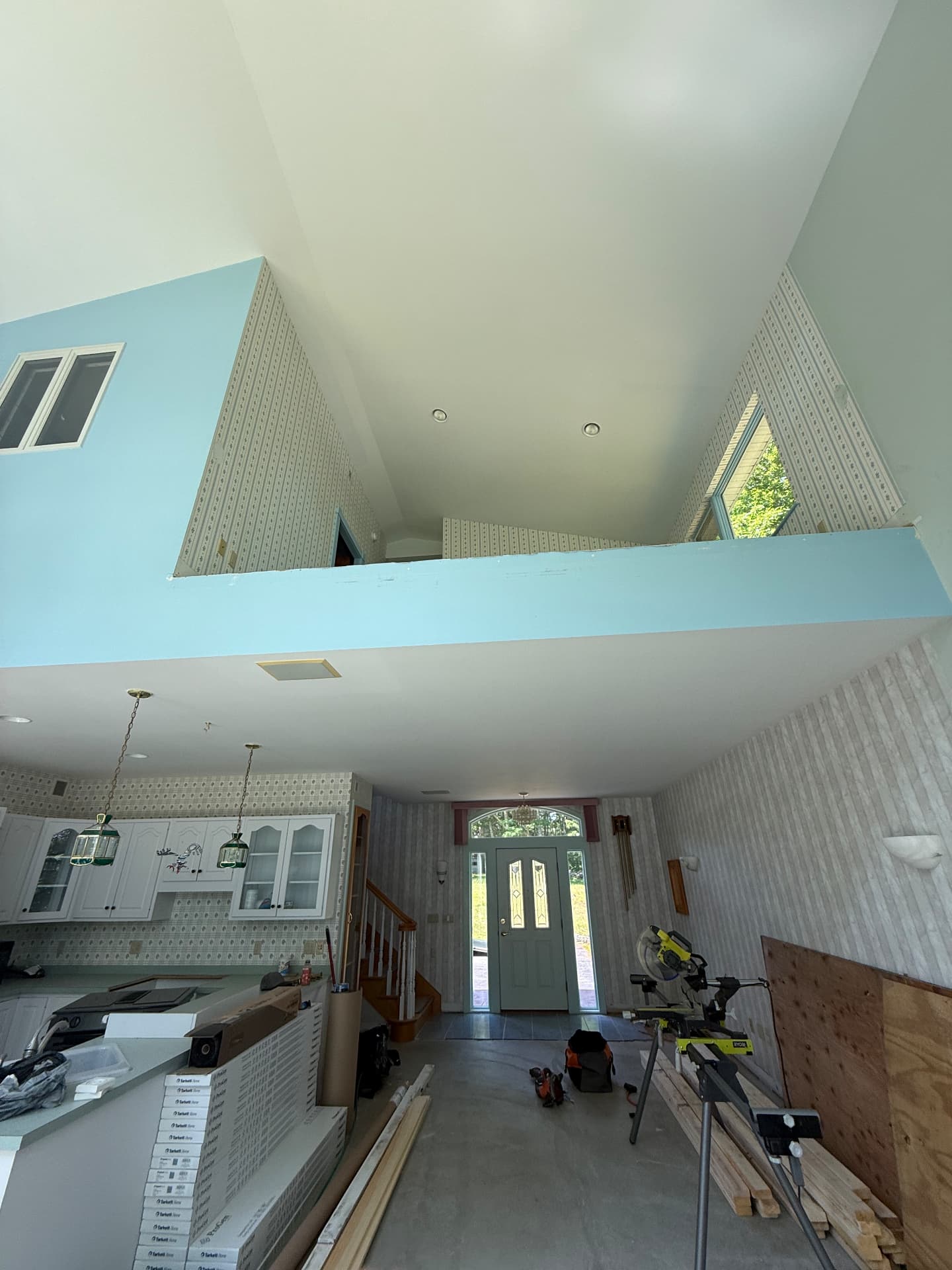 Vaulted entry and loft interior before renovation work begins